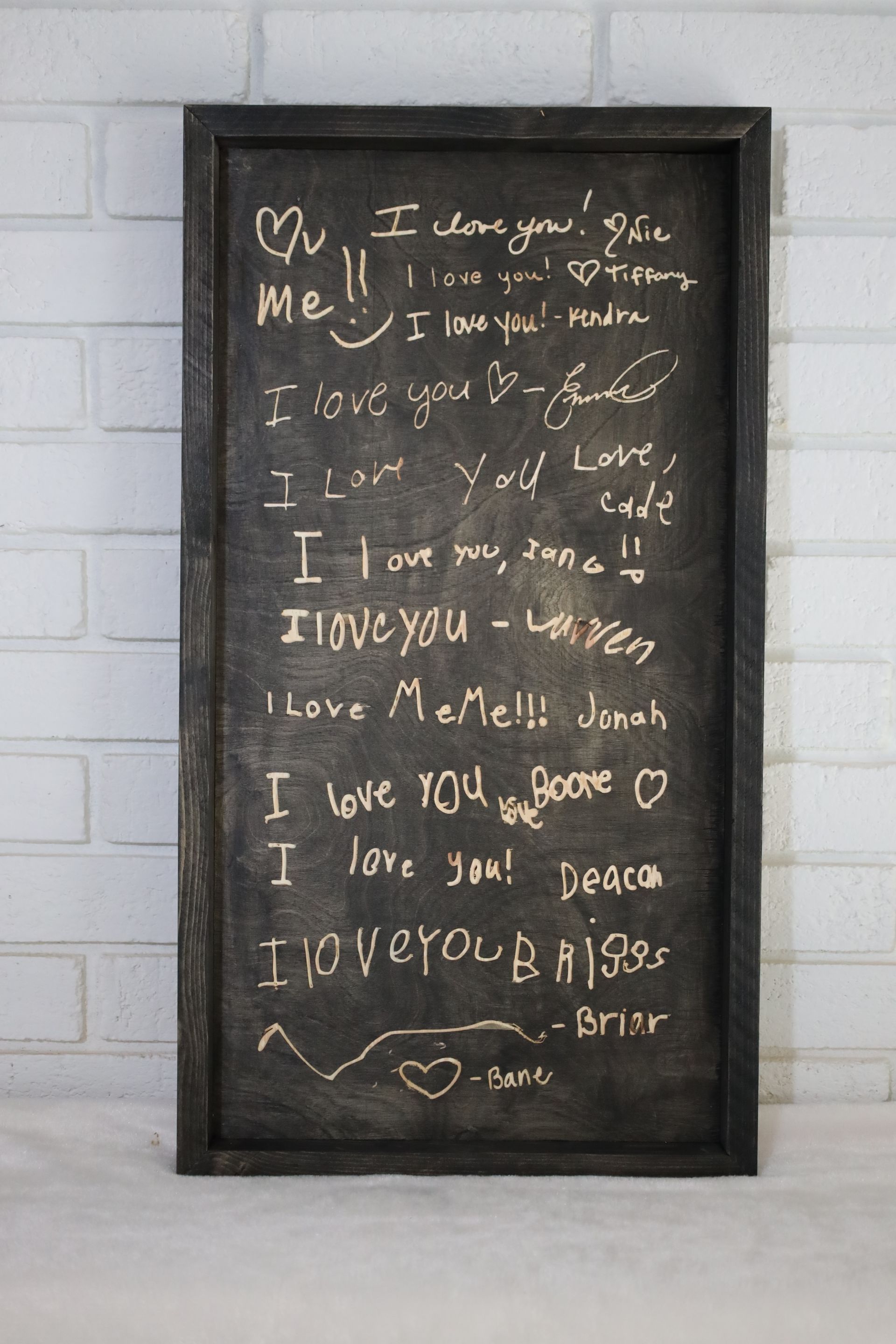 Black wooden sign with 