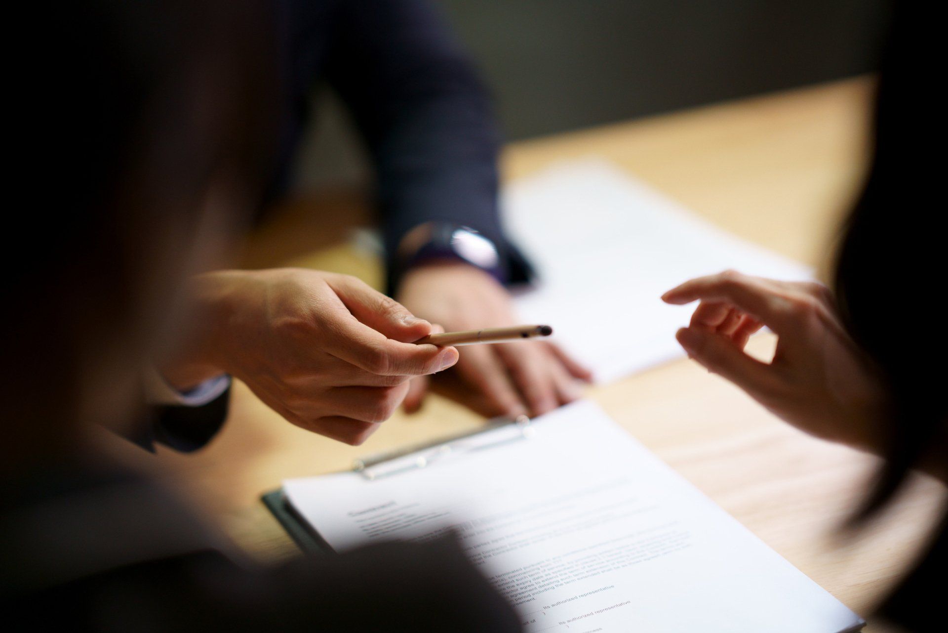 Man Handing Over A Pen — Gallatin, TN — The Stubbs Law Group