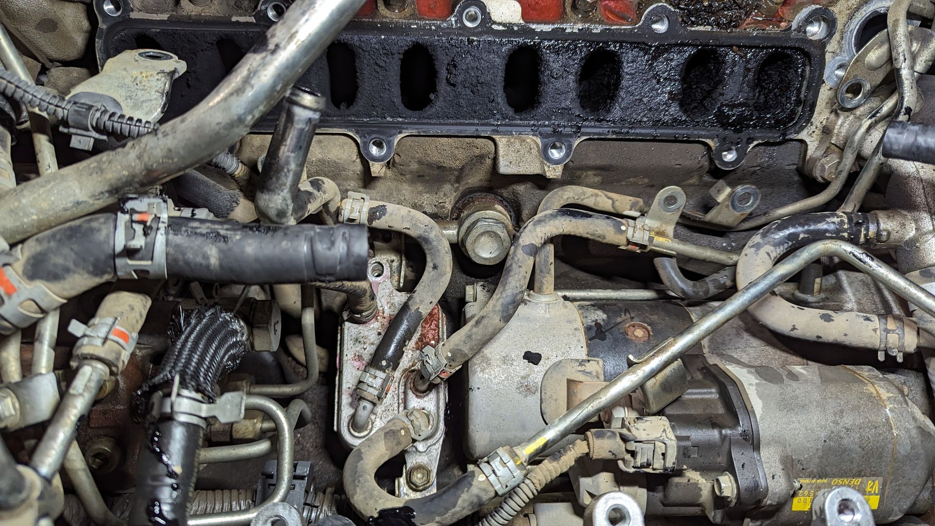 Engine bay with removed intake manifold, hoses, and components visible — ATD Automotive in North Wollongong, NSW
