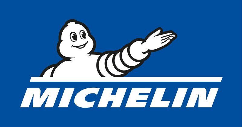 Michelin logo with the white Michelin Man mascot on a blue background