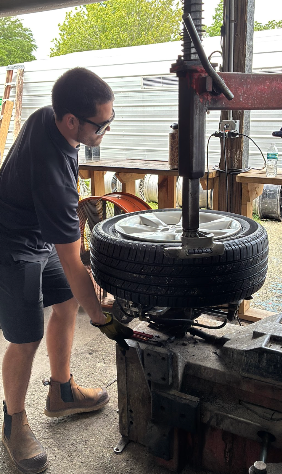 Tire technician working at service bay