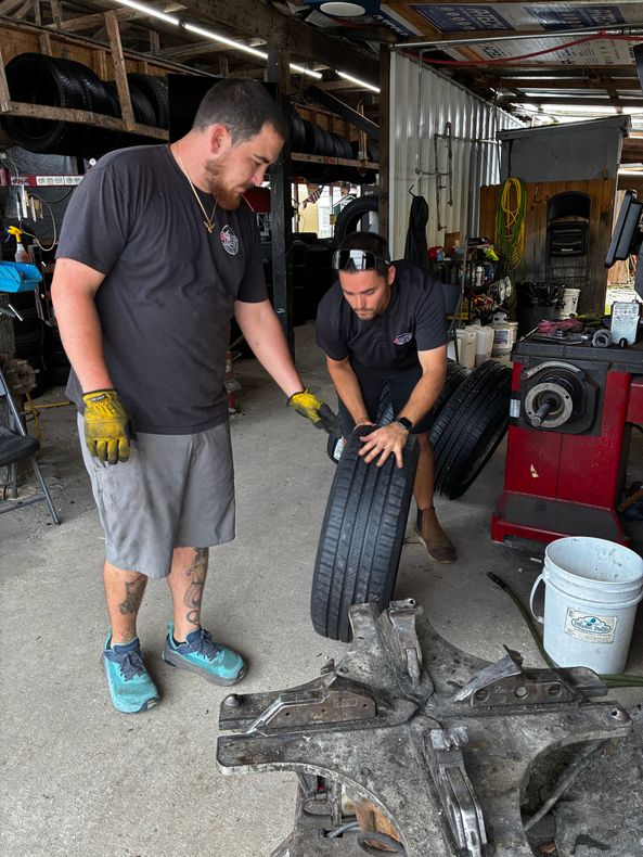 Tire technician working at service bay