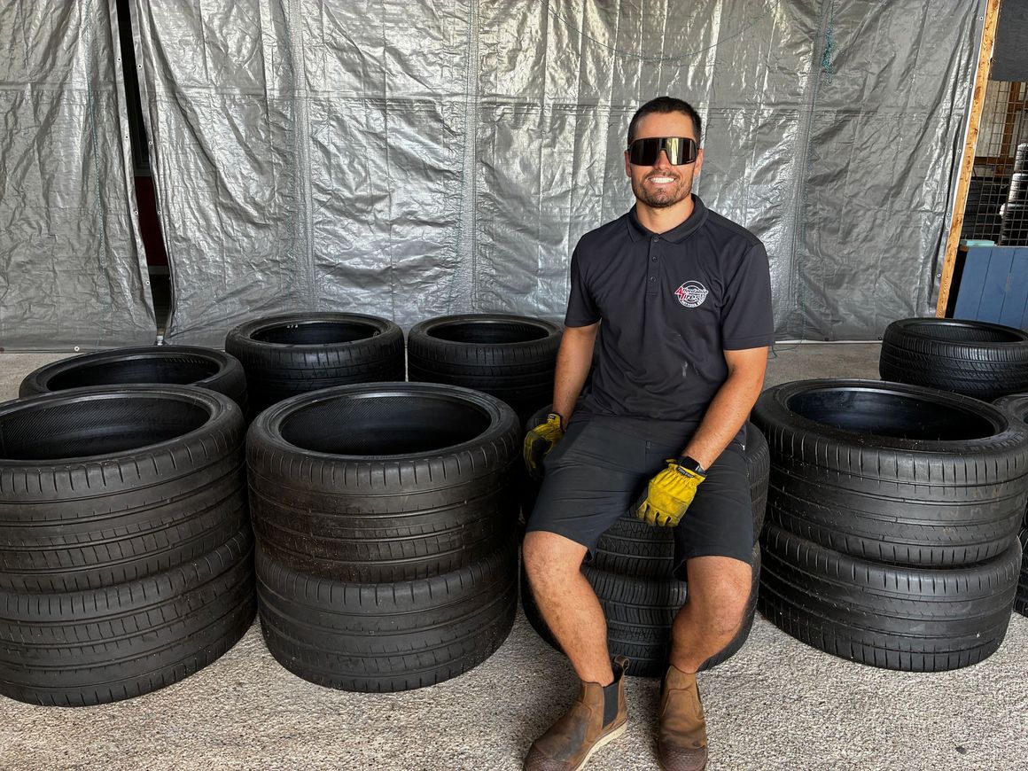 Technician mounting a tire on a rim