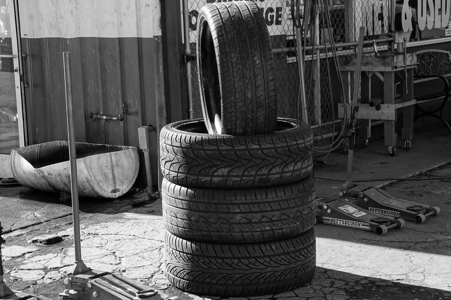 Tires stacked in organized shop
