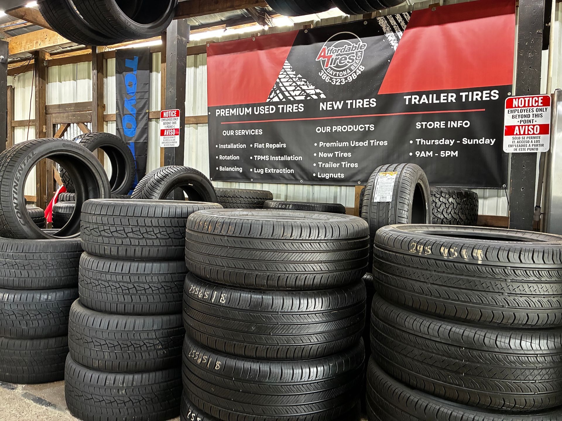 Row of stacked quality tires in a clean tire shop