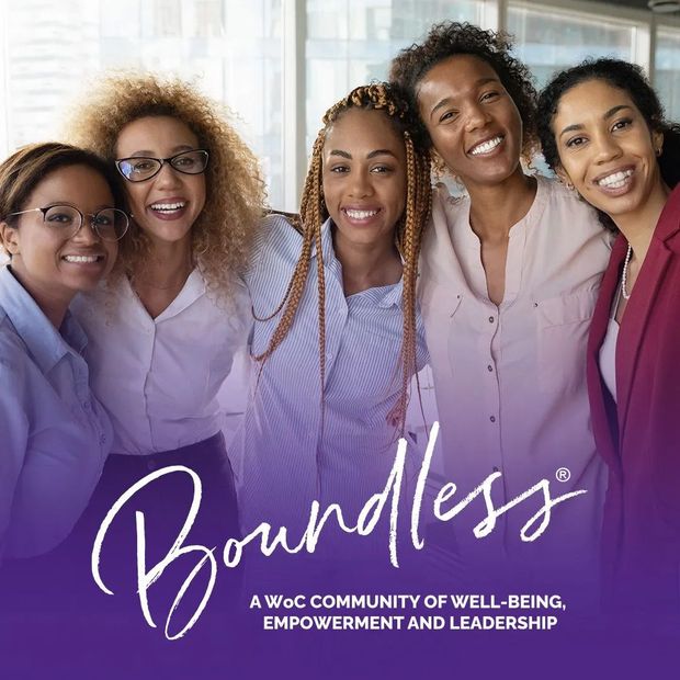 Five smiling women embracing;