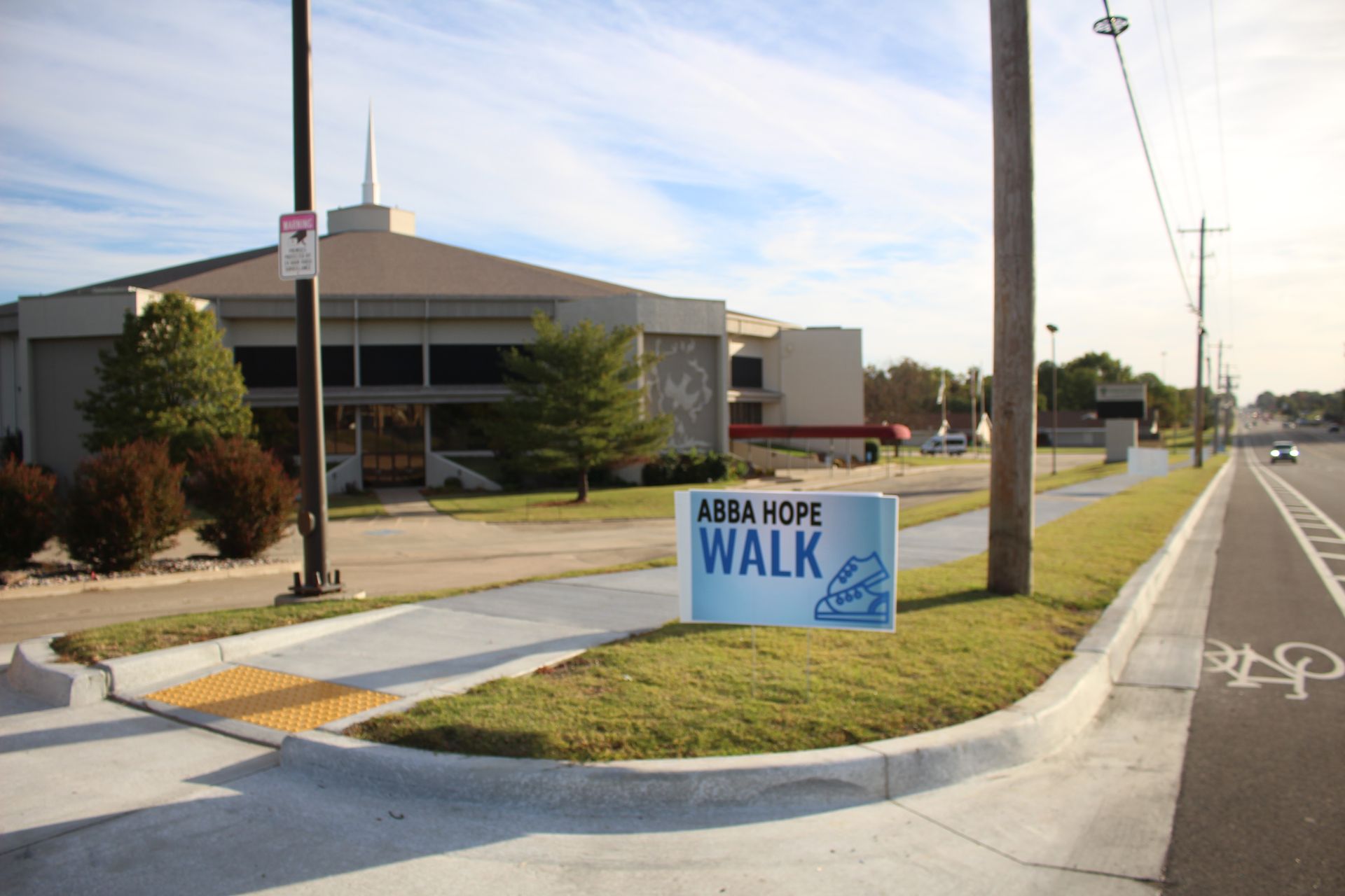 A sign on the side of the road that says walk