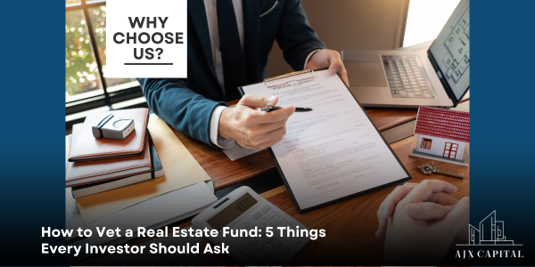 Businessperson reviewing real estate fund paperwork at a desk, with a laptop and brochure labeled “Why Choose Us?”