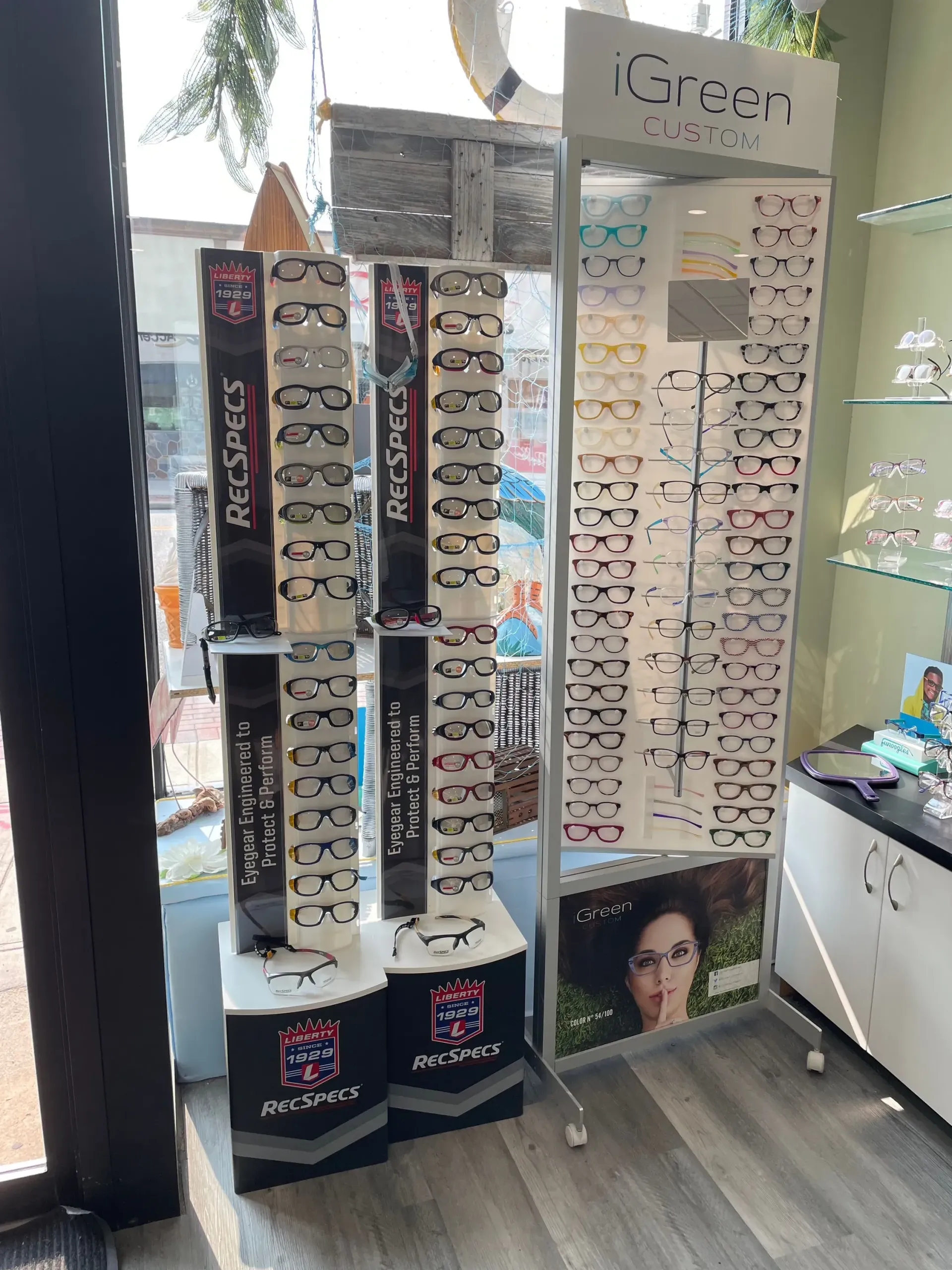 A display of glasses and sunglasses in a store.