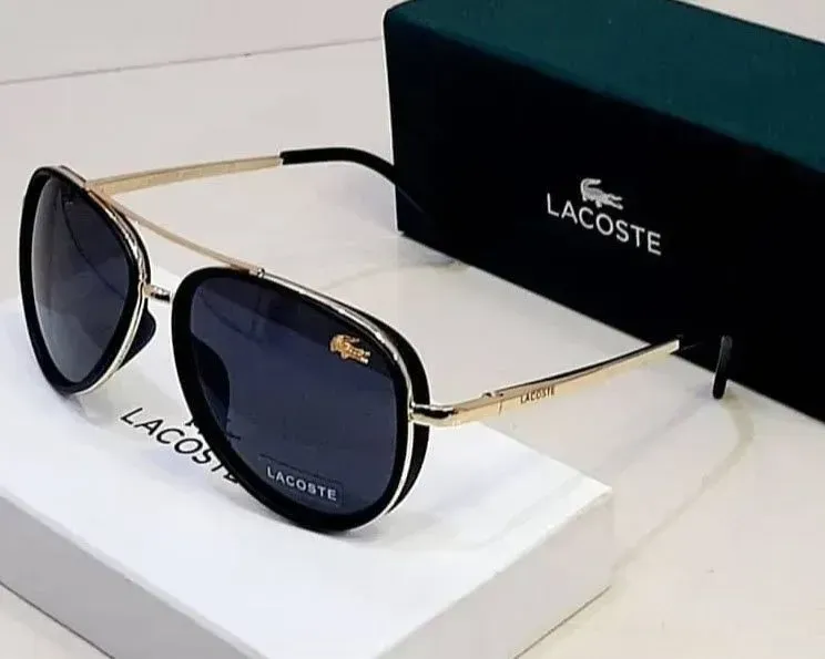 A pair of lacoste sunglasses are sitting on top of a white box.