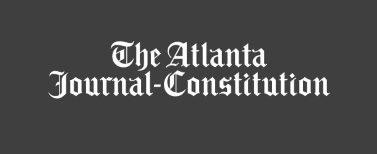 The Atlanta Journal-Constitution logo in white on a dark background
