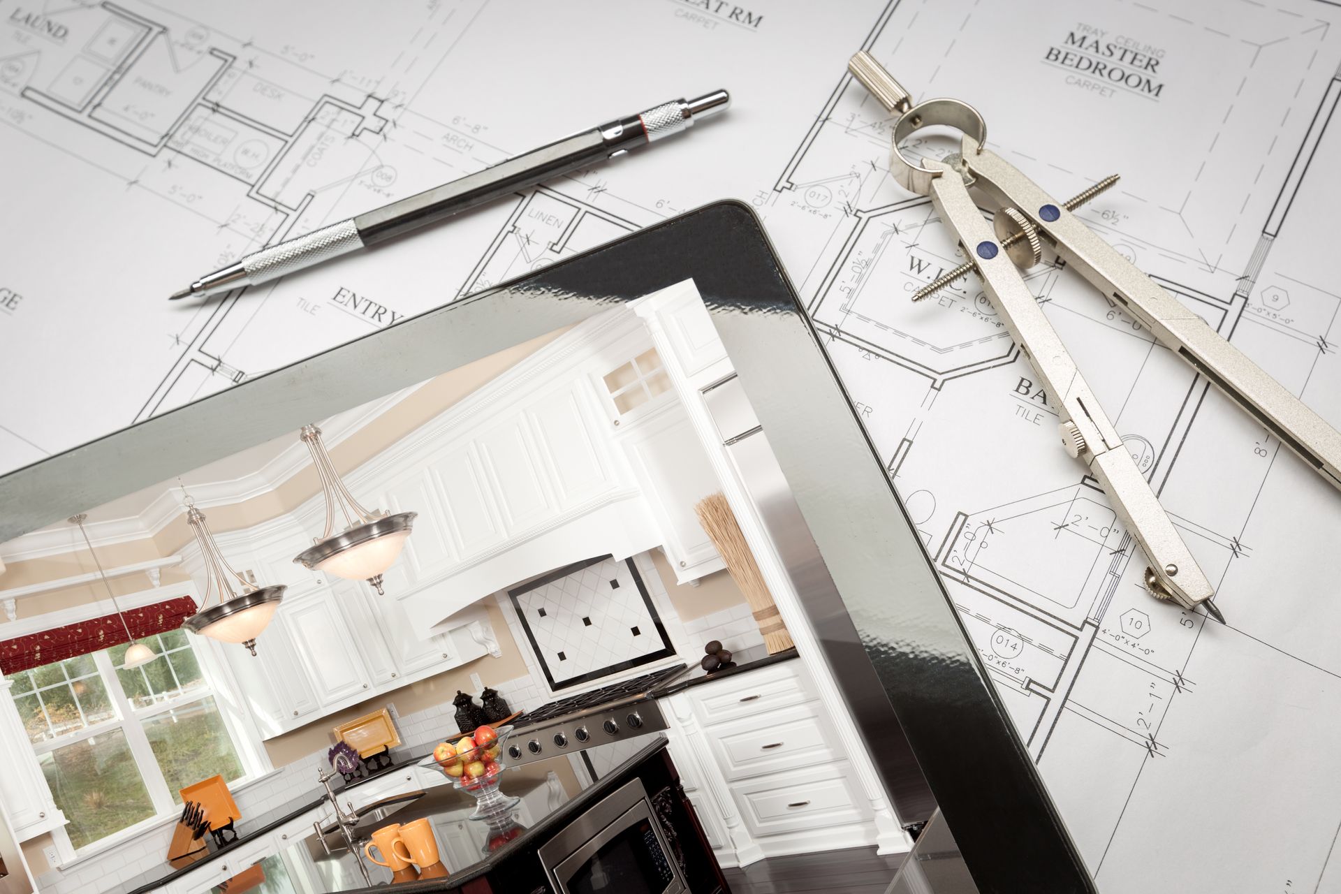 a tablet with a picture of a kitchen on it