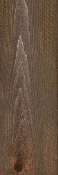 Close-up of brown wood grain with a small dark knot near the bottom center