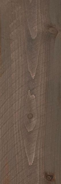 Close-up of a brown wood surface with visible grain and knots