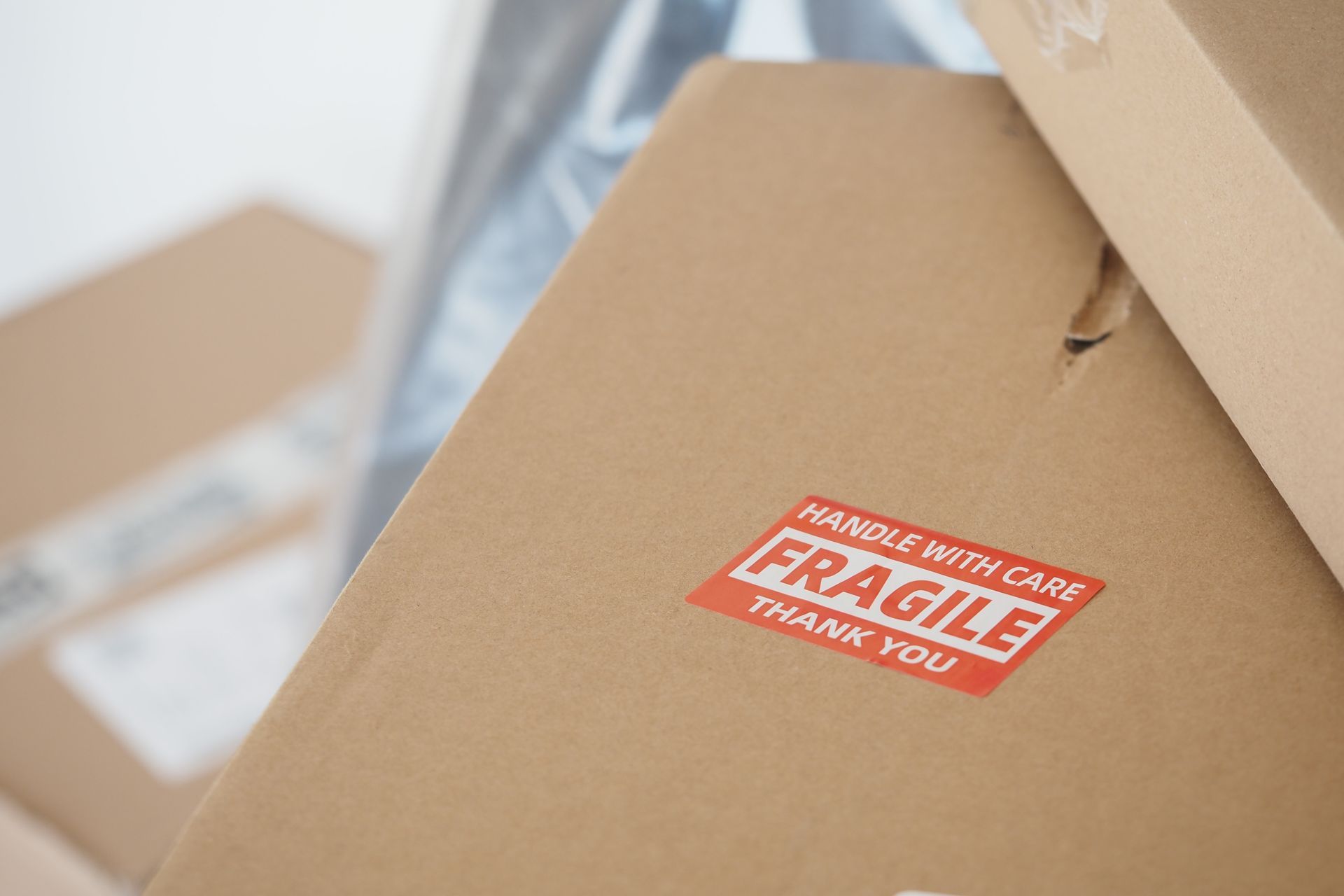 Cardboard boxes with a red “Fragile” label on top