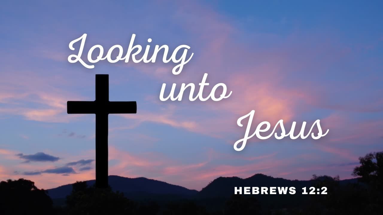 A cross with the words looking unto jesus on it