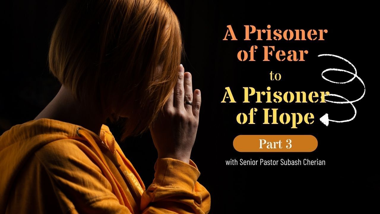 A woman is praying with her hands on her face.