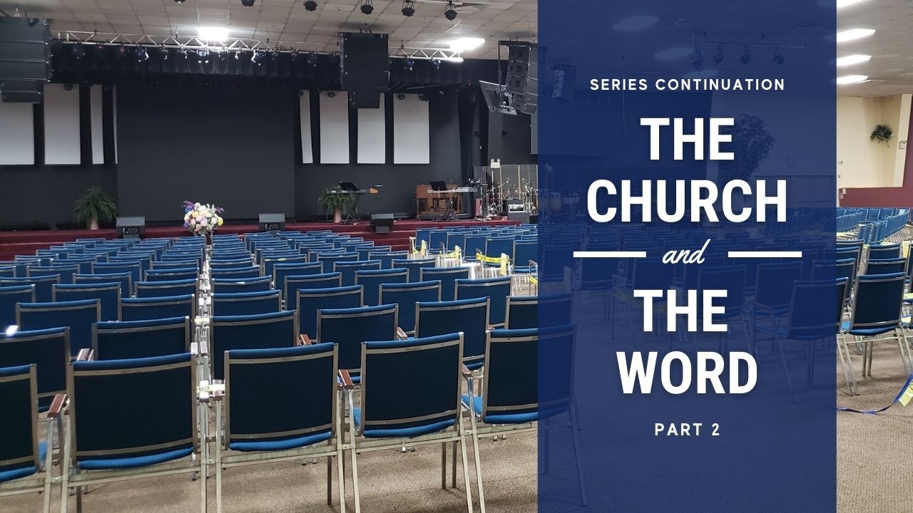 A large auditorium with blue chairs and a sign that says the church and the word