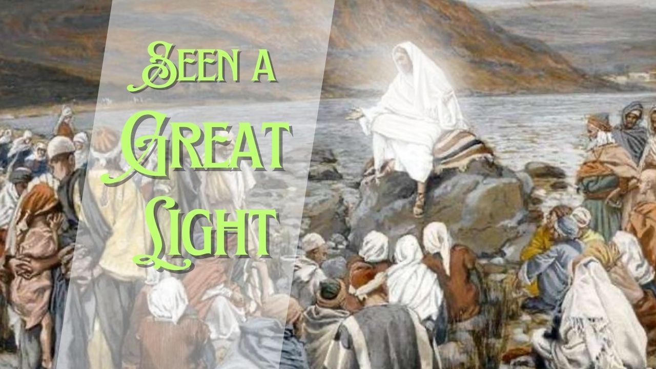 Jesus is standing on a rock in front of a crowd of people.