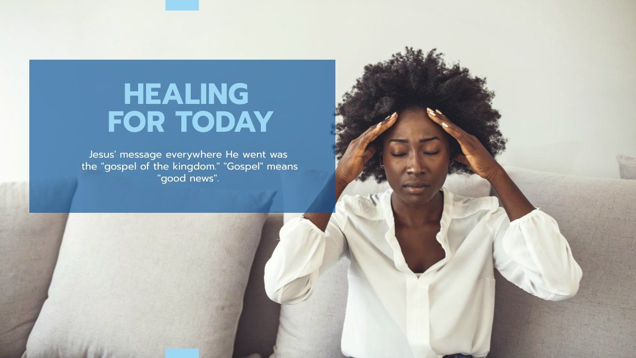 A woman is sitting on a couch with her head in her hands.