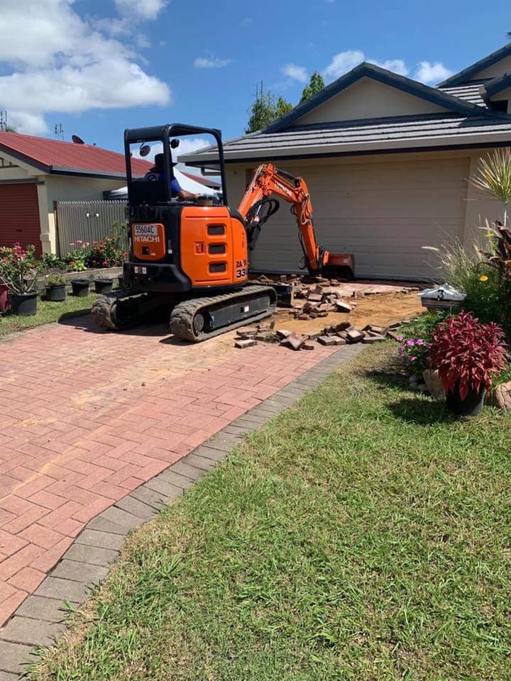 Excavator On Site Prepping Driveway — Outdoor Concreting in Townsville, QLD