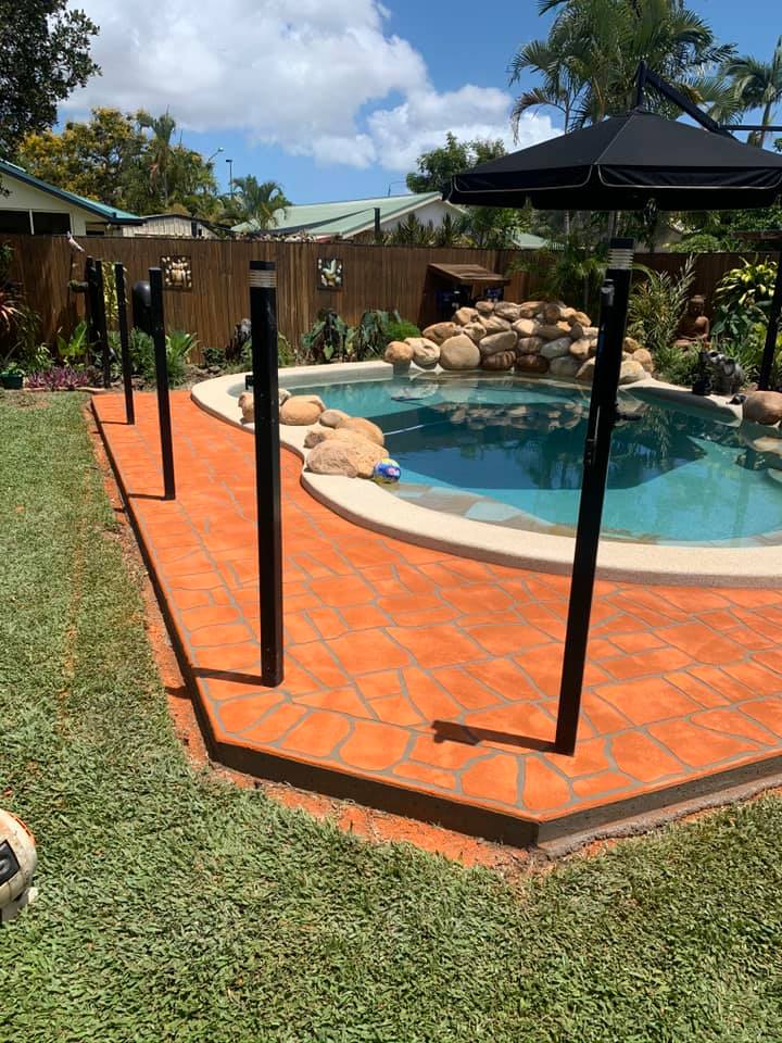 Stencil Concrete Orange Terracotta Poolside — Outdoor Concreting in Townsville, QLD