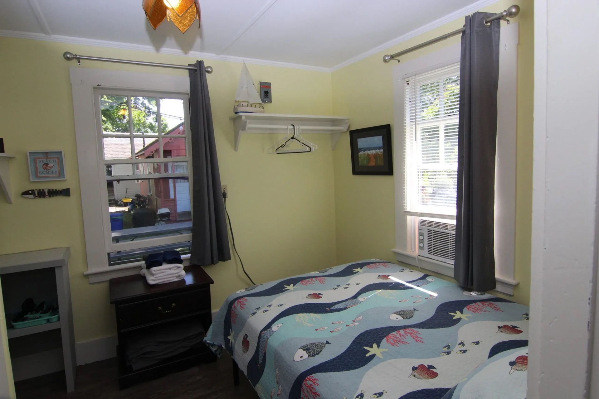 Small bedroom with yellow walls.