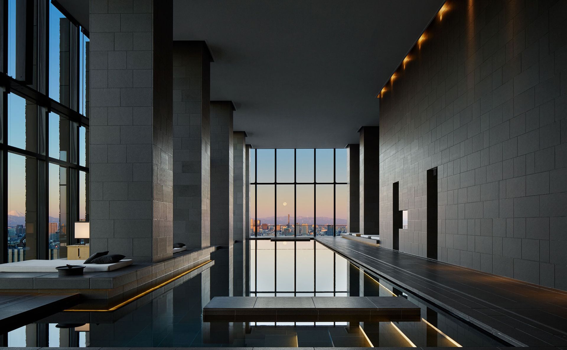 5 Ultra-Luxury Hotels: Tranquil lounge area at Aman Tokyo blending natural elements and modern minimalism.