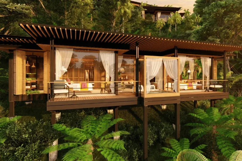 An elevated luxury villa with floor-to-ceiling glass walls, sheer curtains, and a private balcony seamlessly integrated into a dense Balinese jungle.