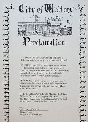A city of whitney proclamation with a picture of a building on it.
