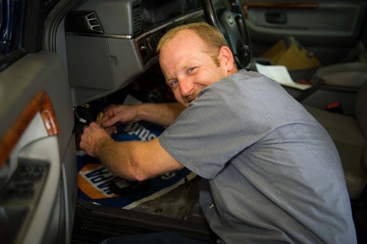 Technician Performing Vehicle Electrical Repair | Protime Automotive