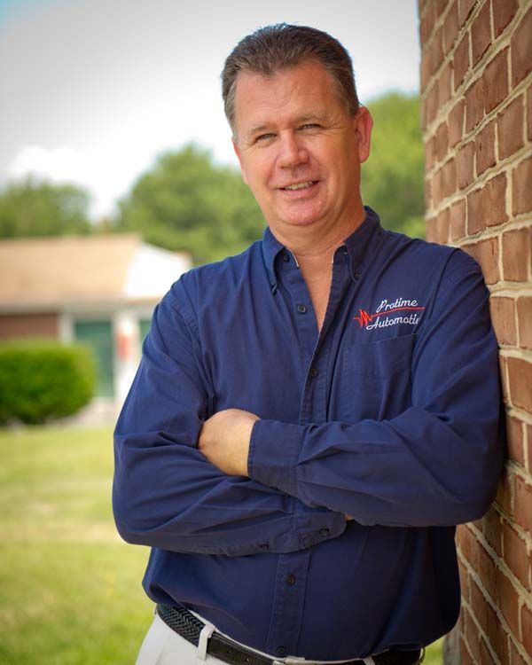 Protime Automotive Team Member Outside The Shop | Protime Automotive