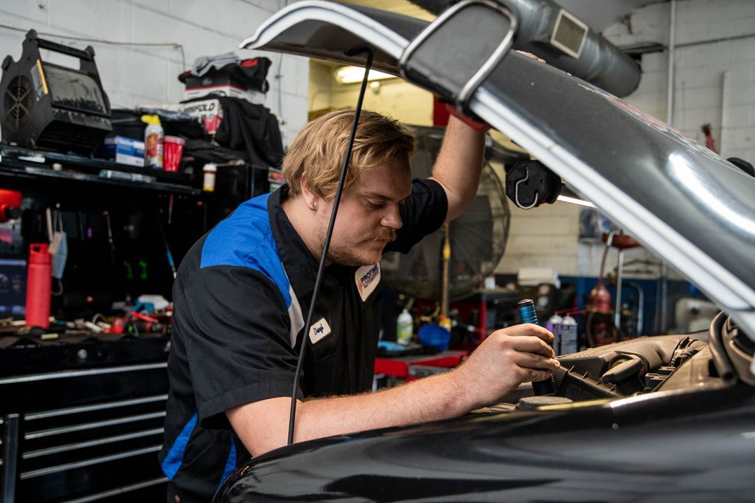 Technician Performing Underhood Vehicle Inspection | Protime Automotive