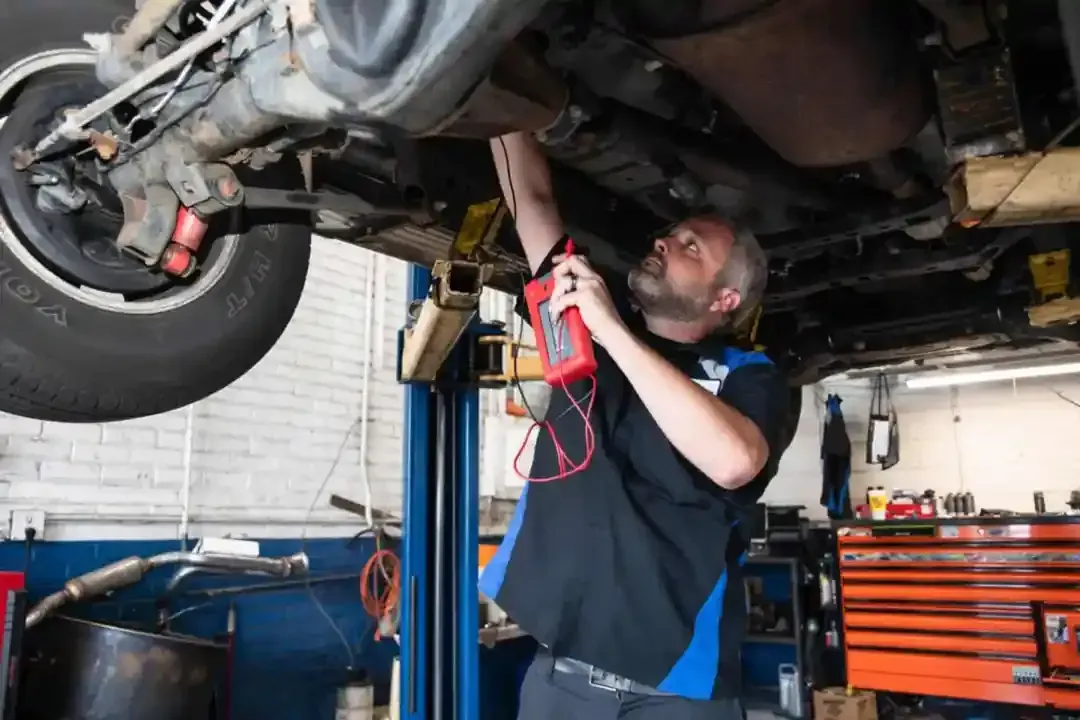 Auto Technician Performing Engine Bay Service | Protime Automotive