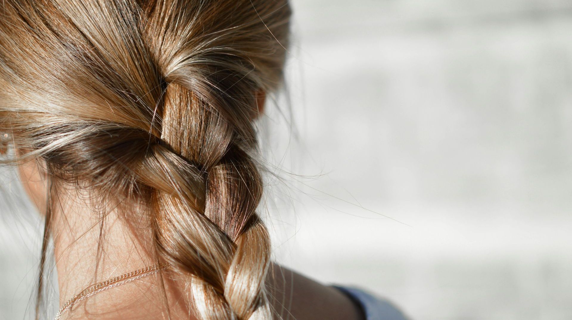 A close up of a woman 's braided hair.
