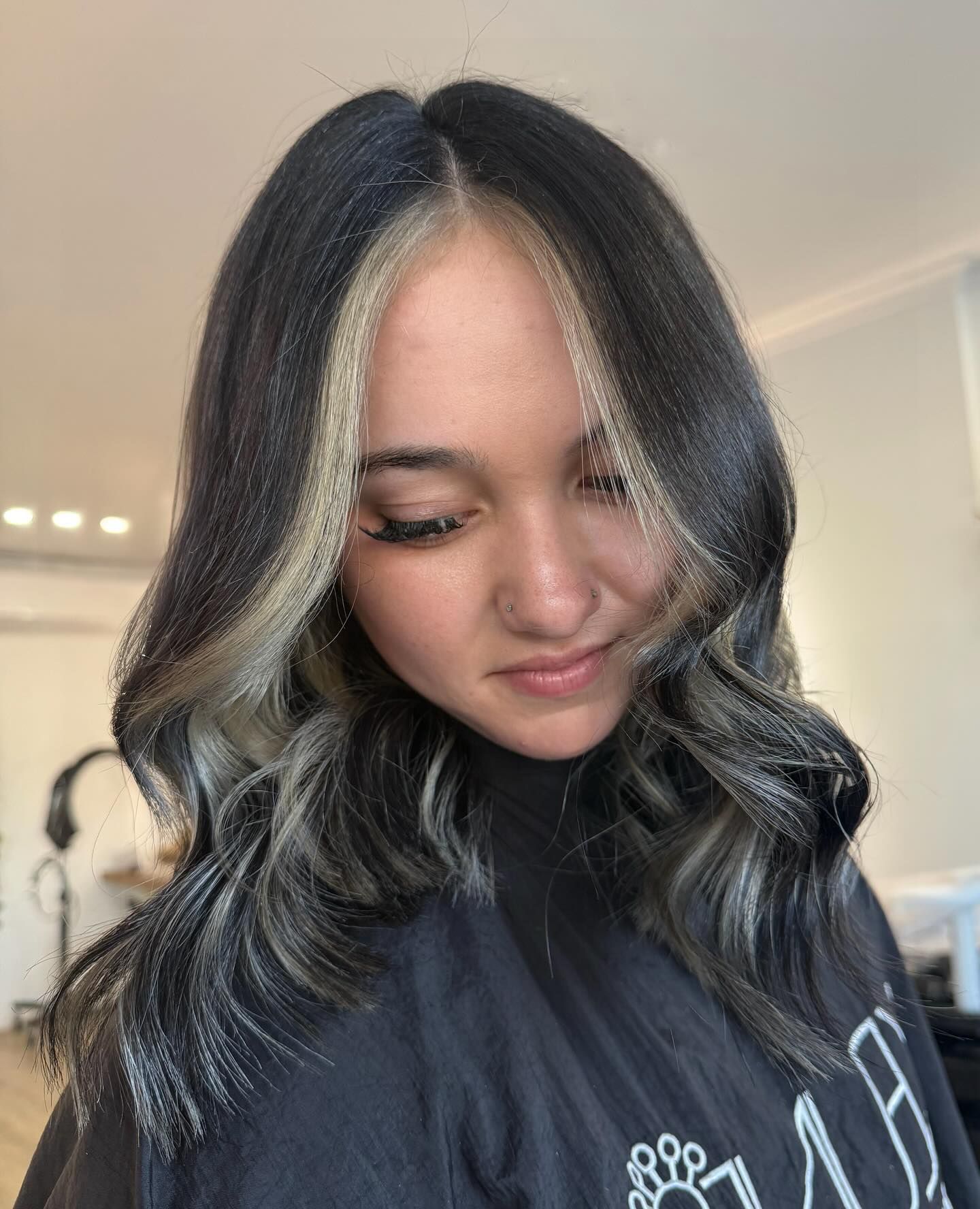 Woman with dark hair, light face-framing highlights — Eden Hair in Pacific Paradise, QLD
