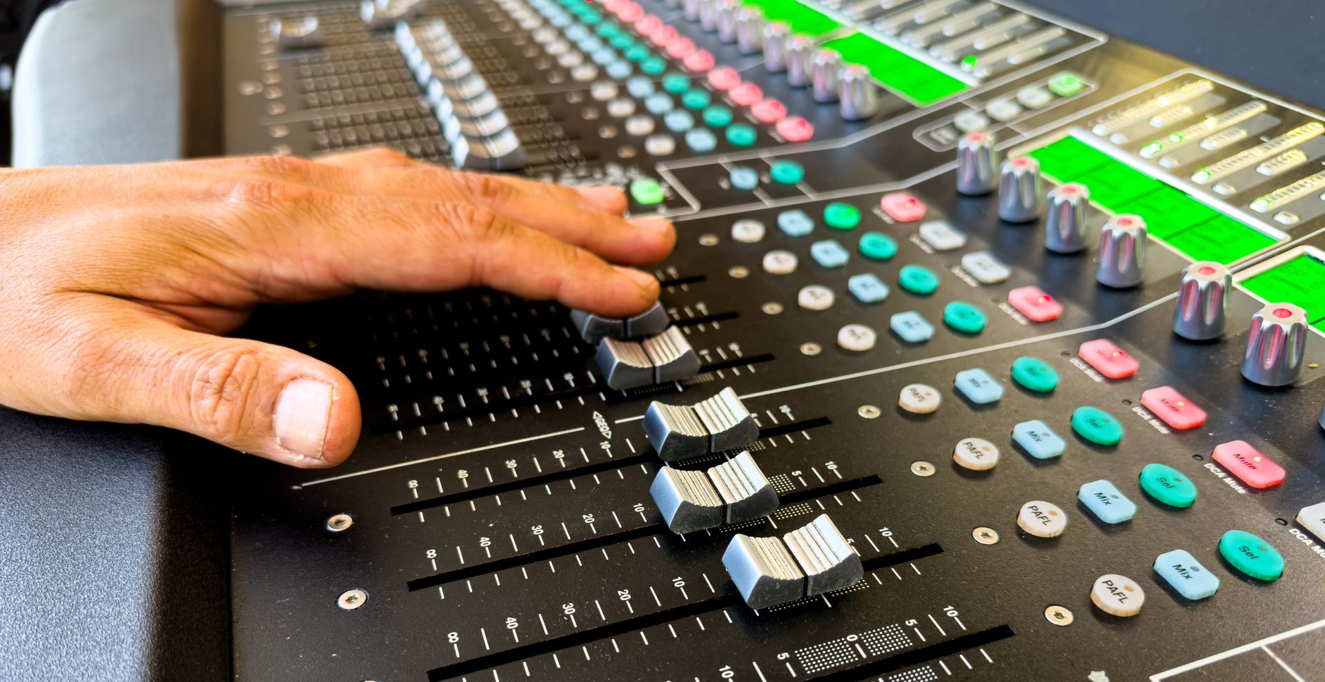 AV equipment rental mixing console close-up for corporate events.