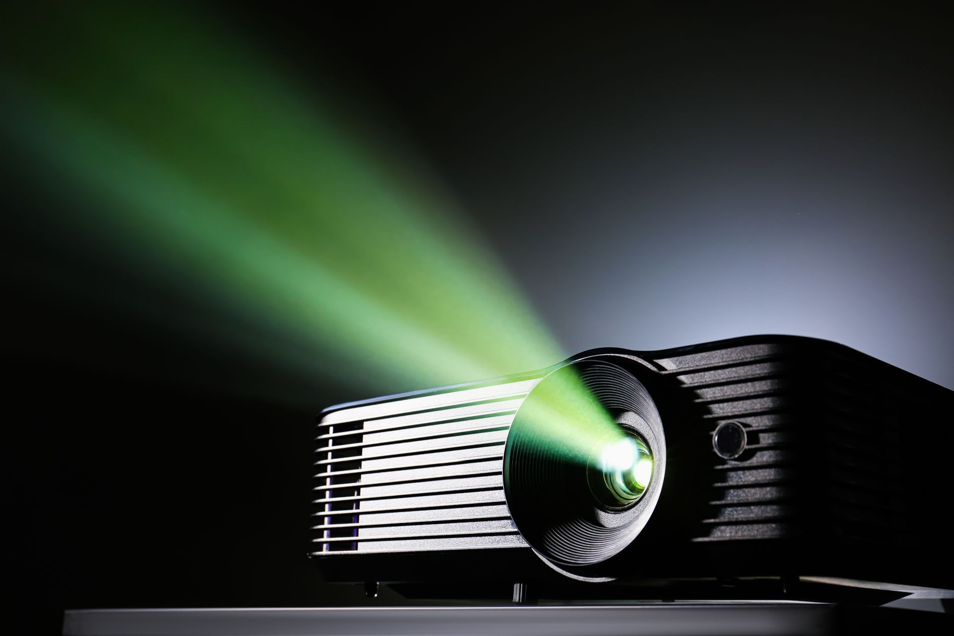 Projector rental setup with a projector and screen ready for a business presentation