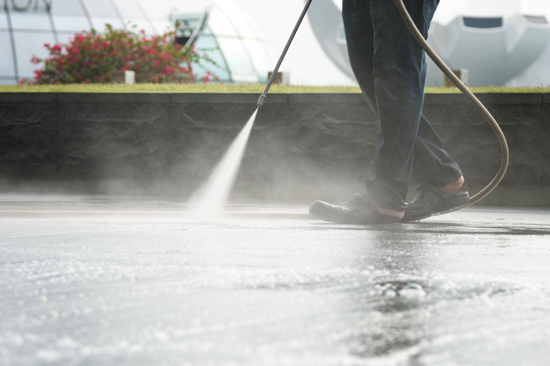 Owner-operator setting up surface cleaning equipment on a residential driveway in Central City, Kentucky. Owner-operator setting up surface cleaning equipment on a residential driveway in Central City, Kentucky.