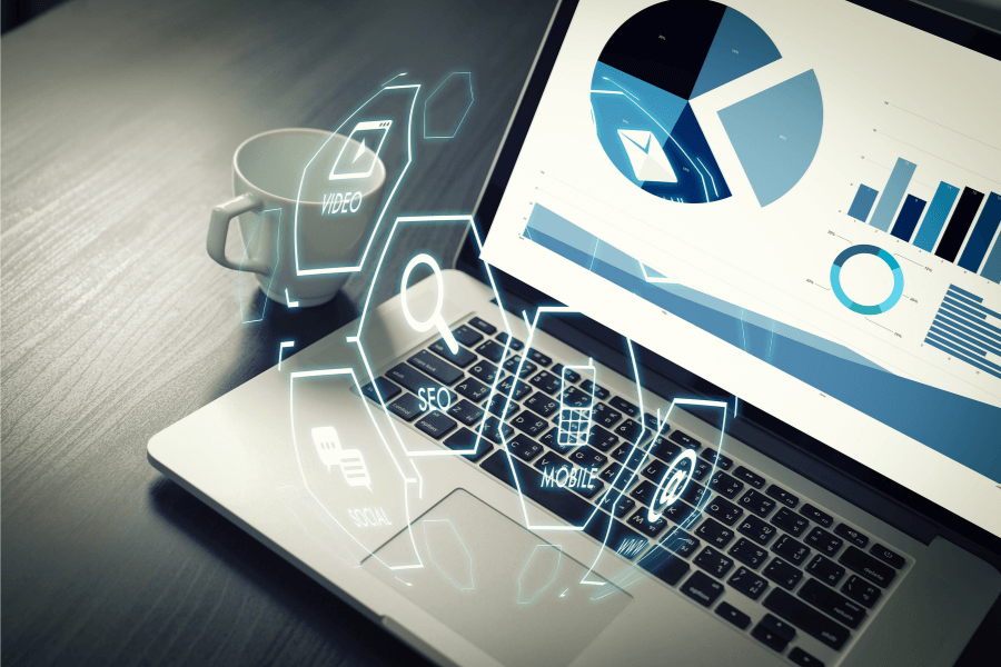 SEO charts are being displayed on a laptop computer