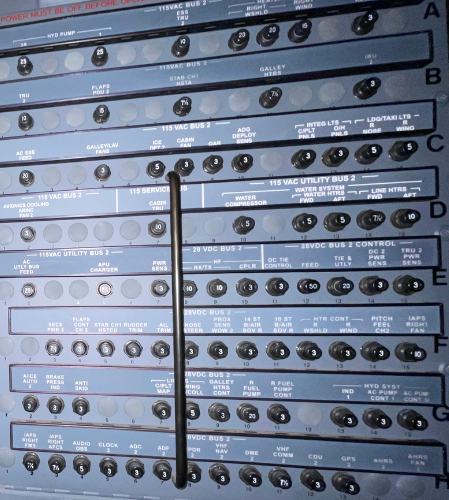 A bunch of buttons on a wall with letters a through h