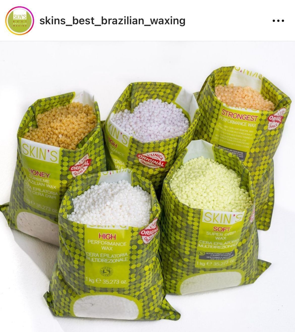 Five bags of colored wax beads for Brazilian waxing on a white background.