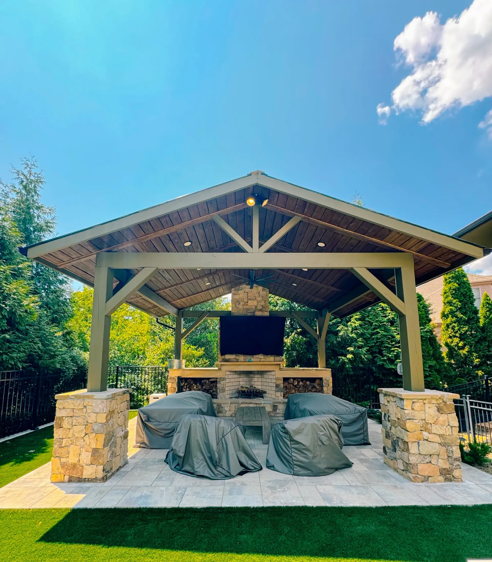 A gazebo with a flat screen tv on top of it