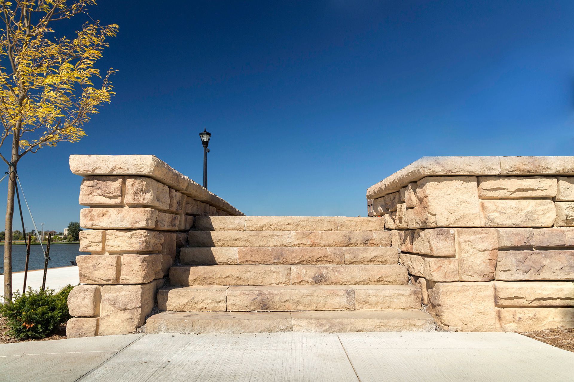A stone wall with stairs leading up to it