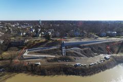An aerial view of a construction site next to a river.