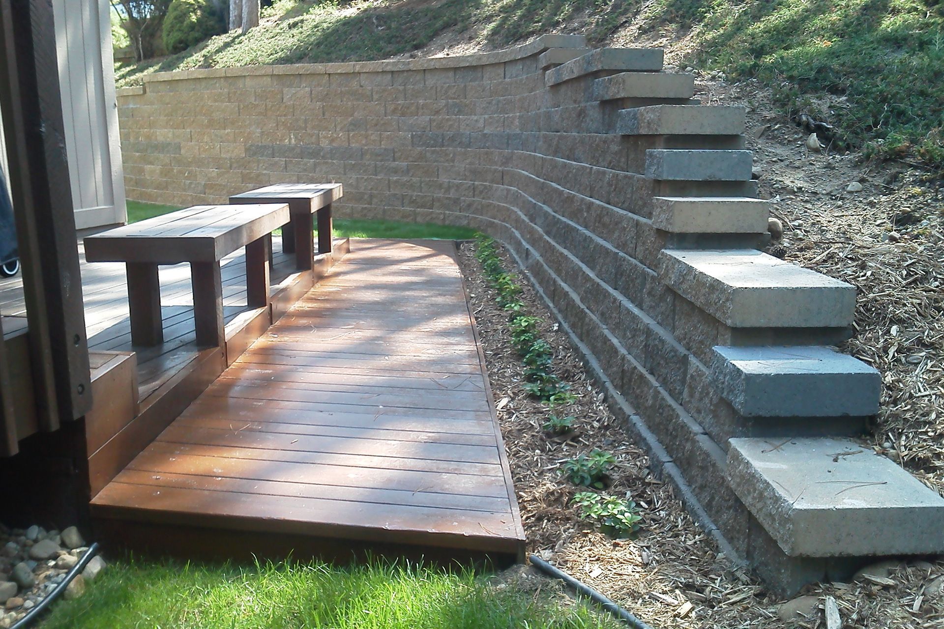 A brick wall with stairs leading up to it