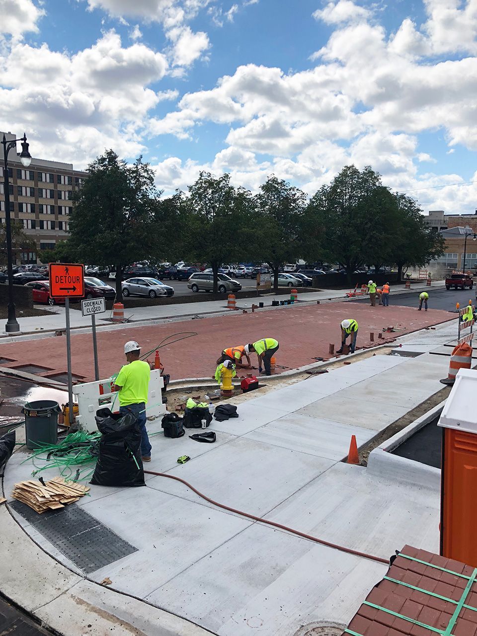 A group of construction workers are working on a roof