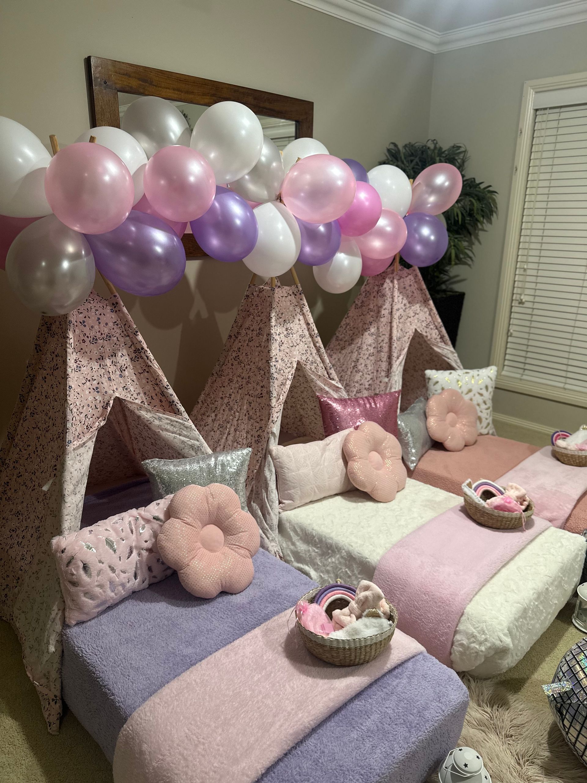 Three Pastel Teepee Beds With Pink and Purple Balloons and Pillows — Sweet Parties & Braids in Tatton, NSW