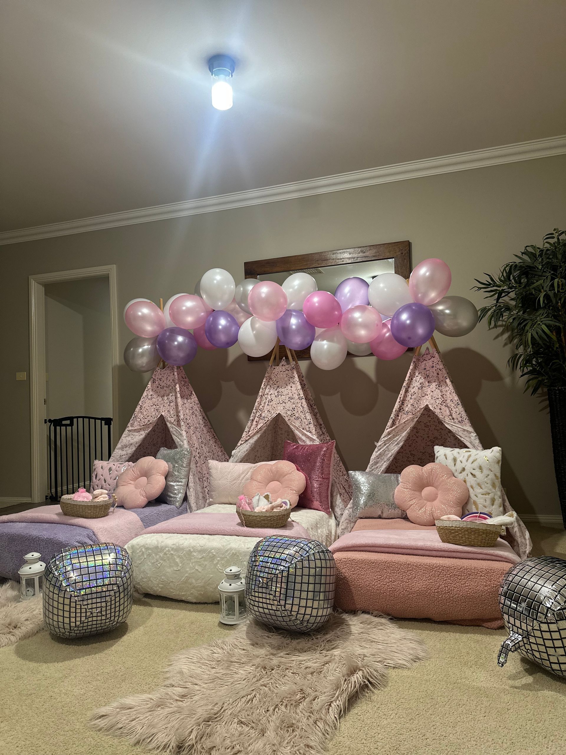 Pastel balloon-and-tent party setup with cushions and floor seating in a living room — Sweet Parties & Braids in Tatton, NSW