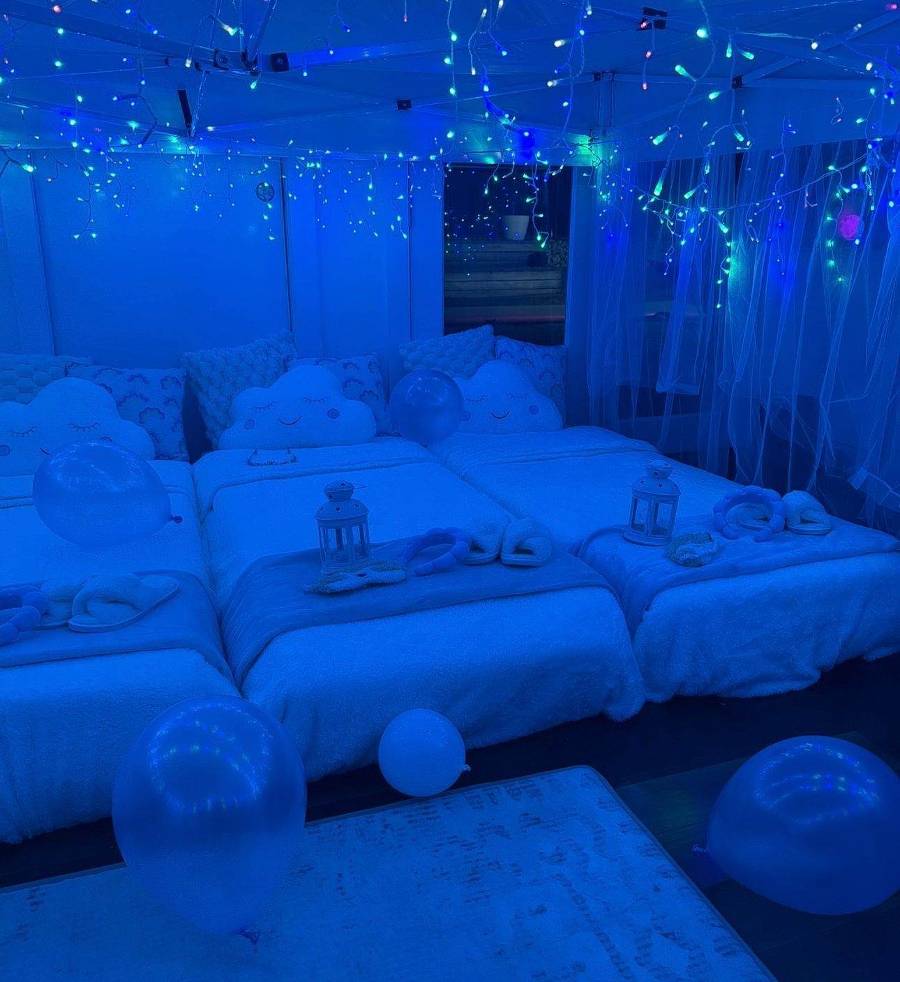 Blue-lit Bedroom With Beds, Fairy Lights, and Balloons — Sweet Parties & Braids in Tatton, NSW